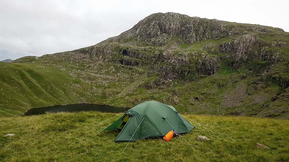 Tent pitched at Angle Tarn with Bowfell behind