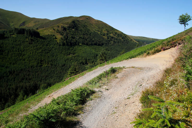 Gravel berm with mountain beyond on the Altura North Trail