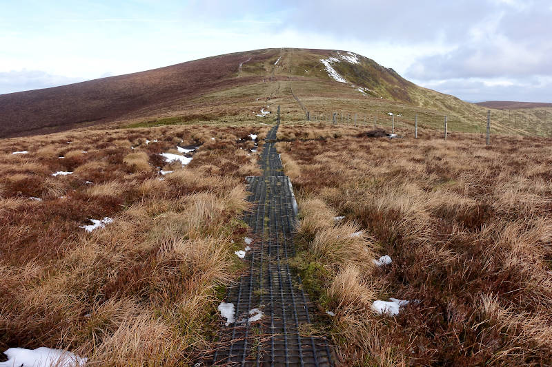 Train sleeper path approach with Cadair Berwyn ahead