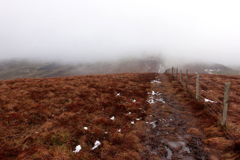 Boggy moorland with mist obscuring the view ahead