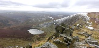 Wintry view of Llyn Lluncaws from Cadair Berwyn