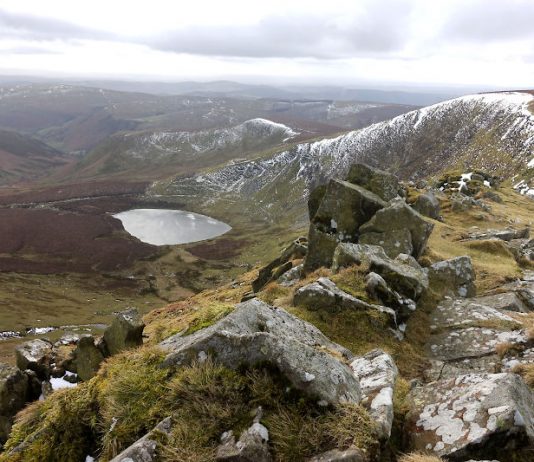 Wintry view of Llyn Lluncaws from Cadair Berwyn