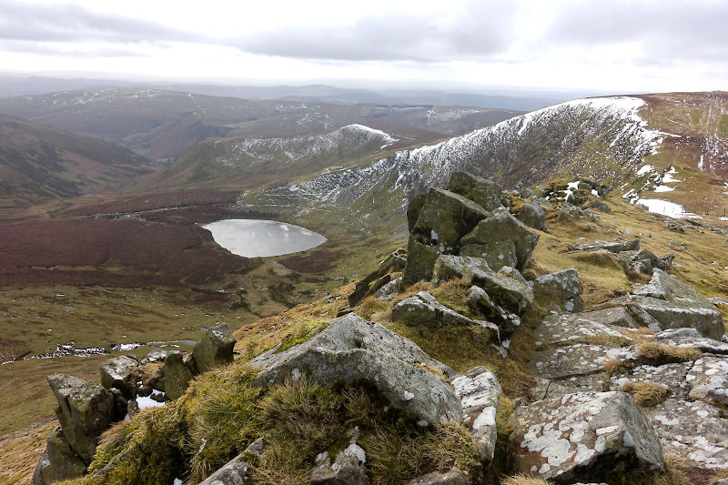 Wintry view of Llyn Lluncaws from Cadair Berwyn