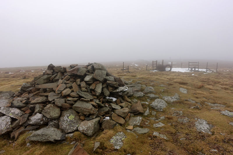 Rock Cairn in mist, marking the summit of Moel Sych