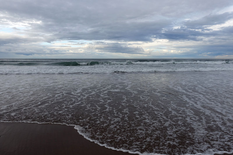 Waves breaking on the beach at Pease Bay